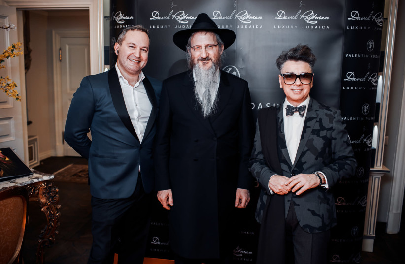 David Roytman with Russia’s Chief Rabbi Berel Lazar and Russian fashion designer Valentin Yudashkin at his boutique in Moscow in 2019 (photo credit: Courtesy)