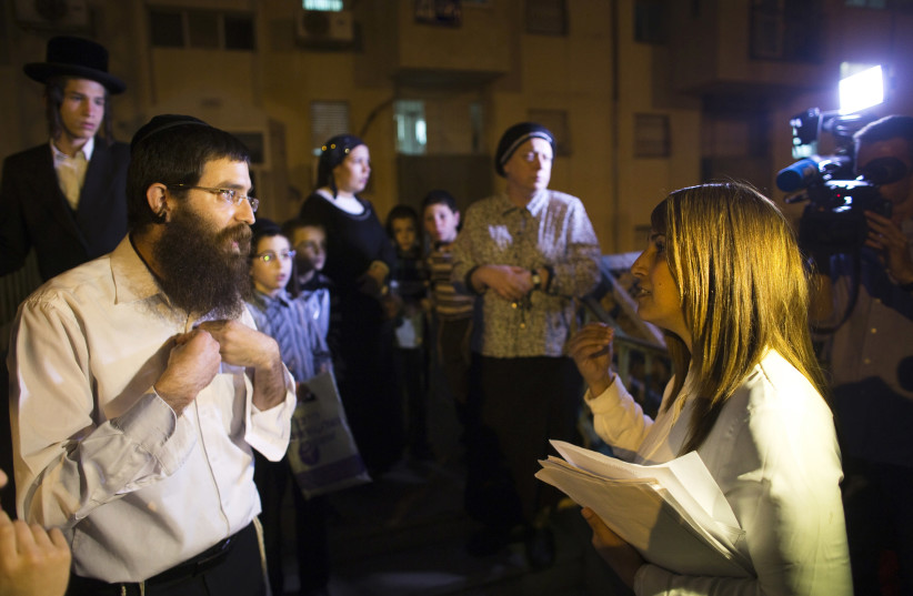 Colian, head of B'Zchutan, Israel's first ultra-Orthodox Jewish women's party, campaigns in Beit Shemesh near Jerusalem (photo credit: REUTERS/Ronen Zvulun)