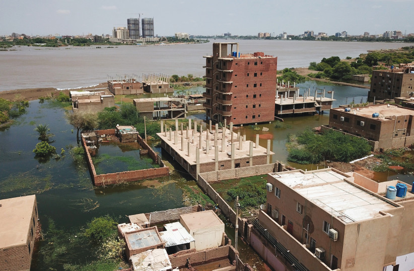 AN AERIAL view, captured via drone, shows buildings and roads submerged by floodwaters near the Nile River in South Khartoum, Sudan, on September 8. (photo credit: REUTERS)