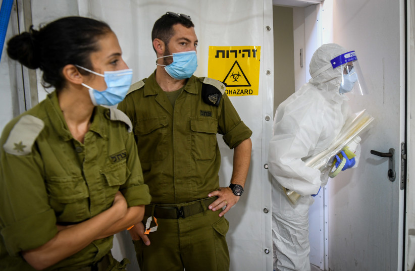 IDF technicians carry out coroanvirus testing, Israel, July 15, 2020 (photo credit: YOSSI ZELIGER/FLASH90)