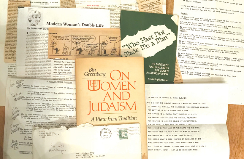 ELAINE TROY’S family-friendly feminist time capsule: the clippings, prayers, letters, cartoon and pamphlet she preserved inside Blu Greenberg’s 1981 book, ‘On Women and Judaism.’ (photo credit: GIL TROY)