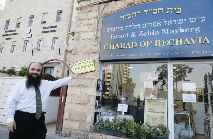 RABBI YISROEL GOLDBERG outside Chabad of Rehavia, adjacent to the World Mizrachi building, seen in the background. (photo credit: MARC ISRAEL SELLEM/THE JERUSALEM POST)