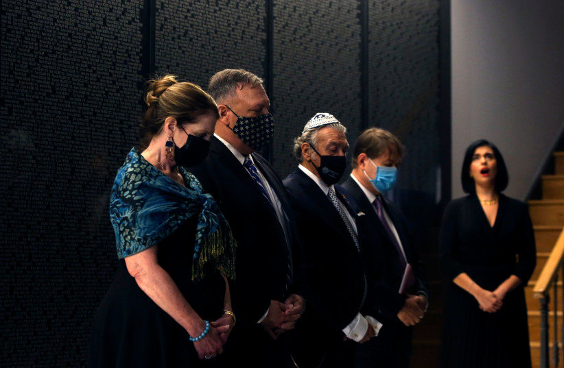 US Secretary of State Mike Pompeo and his wife, Susan, left, visit the Jewish Museum of Thessaloniki, Greece with members of the local Jewish community, Sept. 28, 2020.  (photo credit: GIANNIS PAPANIKOS/AFP VIA GETTY IMAGES)