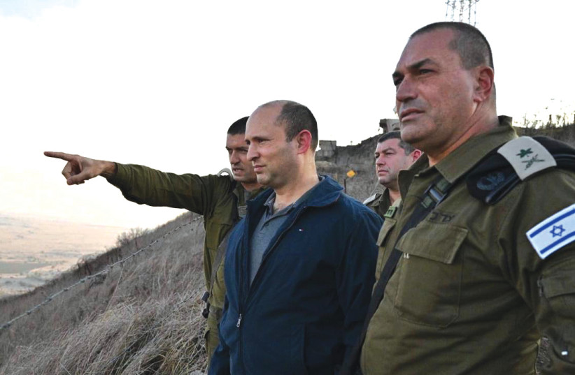 NAFTALI BENNETT receives a briefing during his time as defense minister. (photo credit: ARIEL HERMONI / DEFENSE MINISTRY)