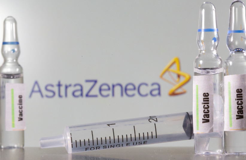 A test tube labelled vaccine is seen in front of AstraZeneca logo in this illustration taken, September 9, 2020. (photo credit: REUTERS/DADO RUVIC)