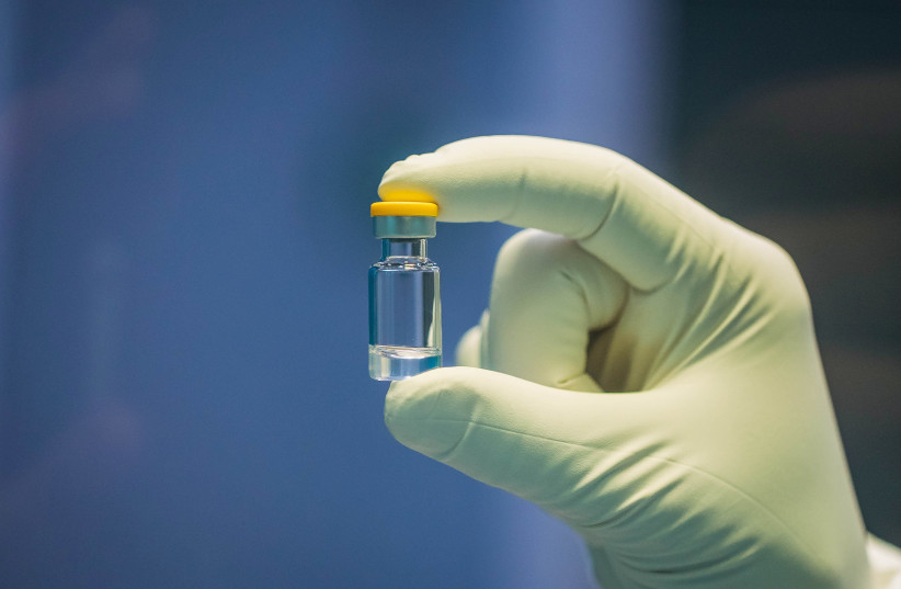 An individual dose of the filled SARS-CoV-2 vaccine candidate made by biotech company IDT Biologika in Dessau-Rosslau, Germany. June 24, 2020 (photo credit: HARTMUT BOESENER/IDT BIOLOGIKA/HANDOUT VIA REUTERS)