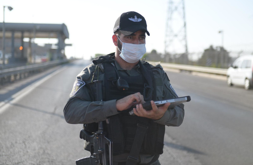 Police officers enforce coronavirus restrictions (photo credit: ISRAEL POLICE)