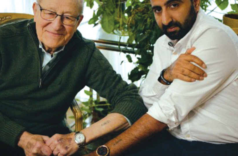 HOLOCAUST SURVIVOR Irving Roth and Muslim-turned-pro-Israel-activist Kasim Hafeez show their matching tattoos in ‘Never Again?’  (photo credit: Courtesy)
