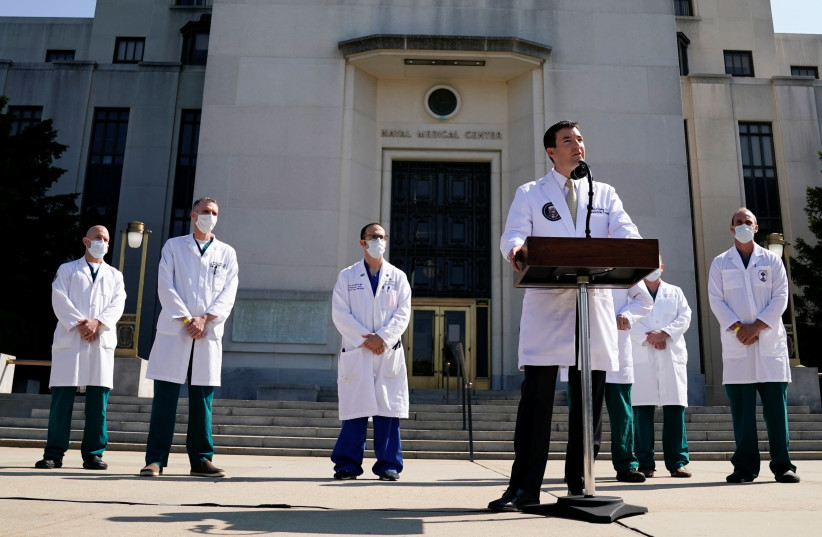 US Navy Commander Dr. Sean Conley, the White House physician, speaks about U.S. President Donald Trump's health, in Bethesda (photo credit: REUTERS)