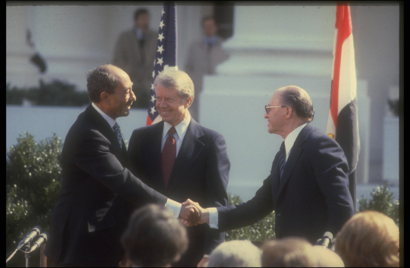 Anwar Sadat, Jimmy Carter and Menachem Begin at the signing of the Camp David Accords in 1979 (credit: GPO)