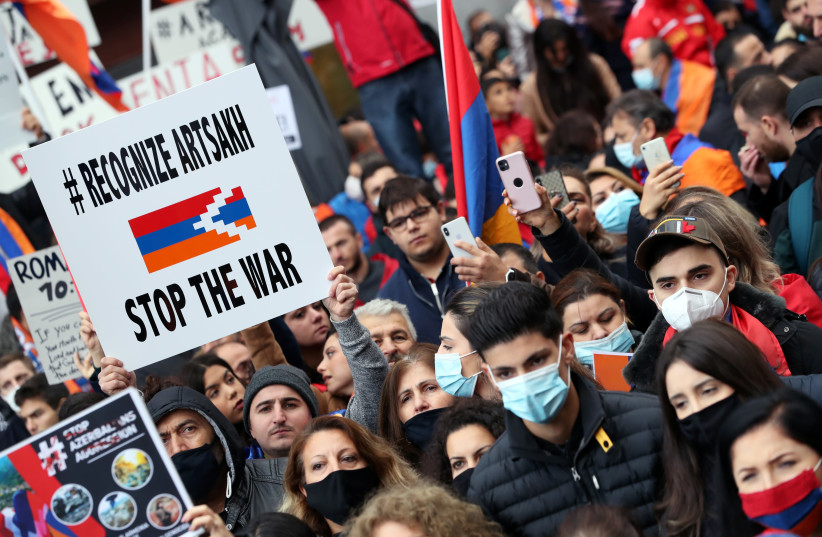 People supporting Armenia protest against the military conflict with Azerbaijan over the breakaway region of Nagorno-Karabakh, in Brussels, Belgium October 7, 2020 (photo credit: YVES HERMAN/REUTERS)