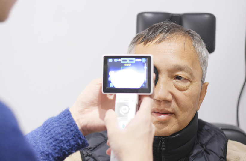 A patient receives a retinal scan using AEYE technology. (photo credit: AEYE HEALTH)