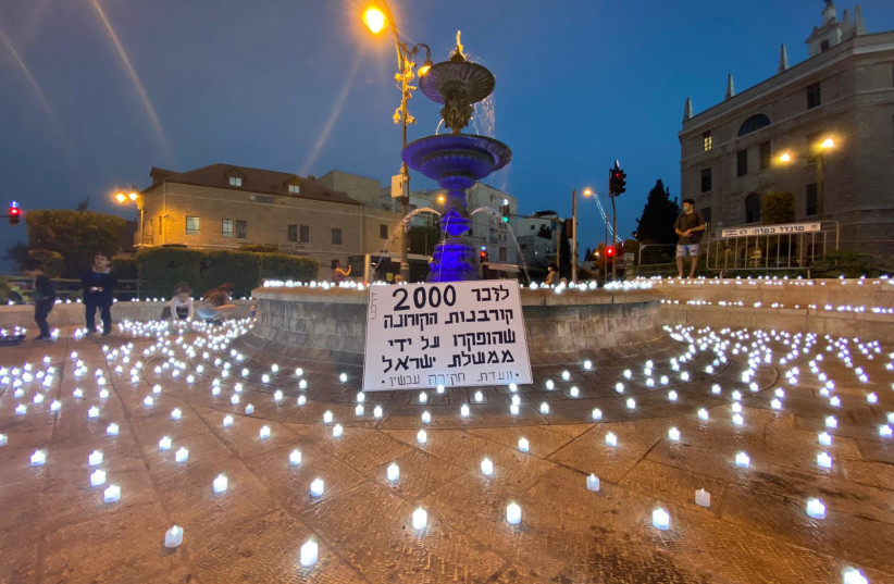 Activists from the moderate Darkenu movement had gathered to light 2,000 candles, one for every victim of the coronavirus pandemic in Israel. 12.10.2020 (photo credit: DARKENU)