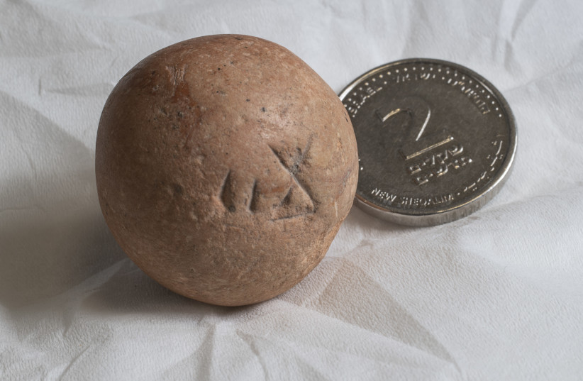 Ancient two-shekel weight (photo credit: Israel Antiquities Authority)