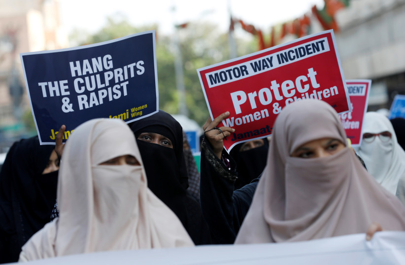 Supporters of religious and political party Jamaat-e-Islami (JI) carry signs against a gang rape that occured along a highway, and to condemn the violence against women and girls, during a demonstration in Karachi, Pakistan September 11, 2020. (photo credit: REUTERS)