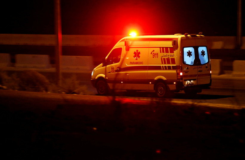 An ambulance heads towards the city of Zarqa on the highway between Jordanian capital of Amman and Zarqa, September 11, 2020 (photo credit: REUTERS/MUHAMMAD HAMED)