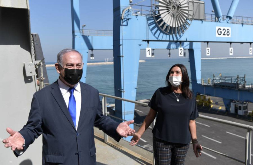 Prime Minister Netanyahu and Transportation Minister Miri Regev at the port of Haifa on October 19, 2020 at the wharf where the container ship from the United Arab Emirates docked. (photo credit: KOBY GIDEON/GPO)