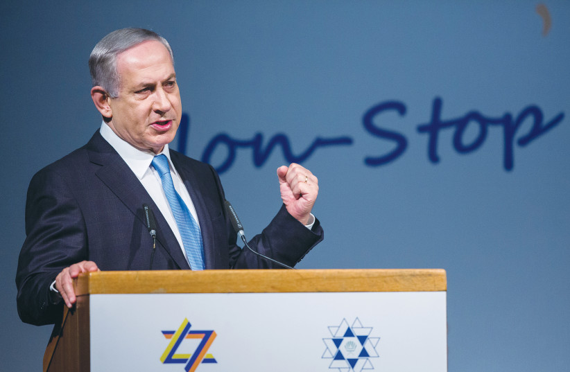 ISRAELI POLITICOS treat the World Zionist Congress like a billion-dollar cash cow. Pictured: Prime Minister Benjamin Netanyahu speaks during the 37th WZC at the Jerusalem International Convention Center in 2015. (photo credit: YONATAN SINDEL/FLASH 90)