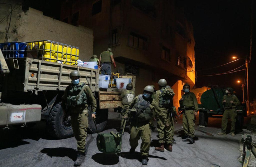 IDF forces seal the room of Nizmi Abu Bakar (photo credit: IDF SPOKESPERSON'S UNIT)