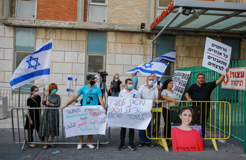 Bereaved families protest outside Hadassah Ein Kerem Hospital in Jerusalem against the medical treatment giving to Chief Palestinian negotiator Saeb Erekat after being infected with COVID-19, October 19, 2020 (photo credit: OLIVIER FITOUSSI/FLASH90)