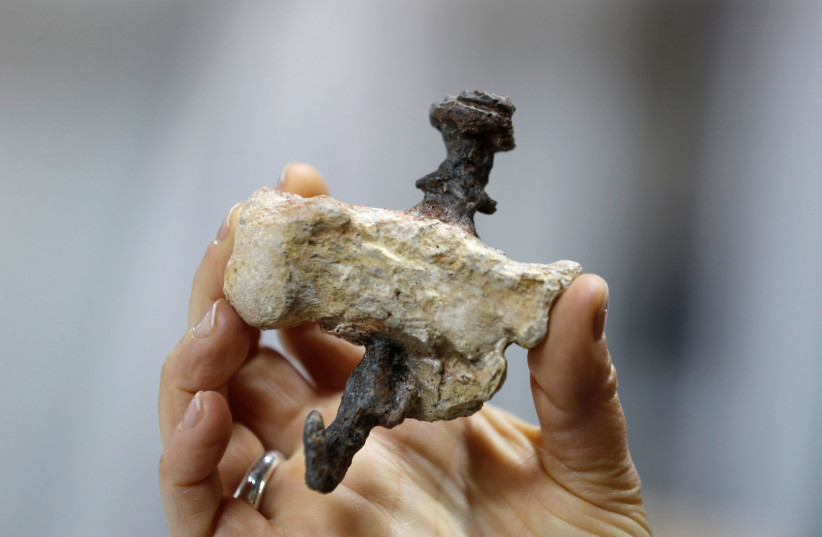 A replica of a find from Jerusalem, shows a heel bone pierced with an iron nail, believed to be the bone of Yehohanan Ben Hagkol, during a media tour presenting significant findings from that time, at Israel's National Treasures Storeroom, in Beit Shemesh. (photo credit: REUTERS)