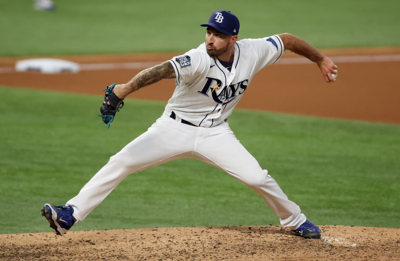 TAMPA BAY RAYS relief pitcher Ryan Sherriff pitches against the Los Angeles Dodgers in the 2020 World Series in Arlington, Texas. The Dodgers hold a 3-2 lead in the best-of-seven series heading into tonight’s Game 6. (photo credit: TIM HEITMAN/USA TODAY SPORTS VIA REUTERS)