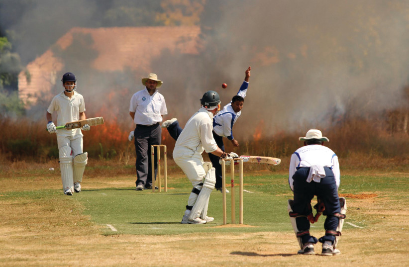 A cricket match in Lod in 2012. Cricket was introduced in Israel by the British during the Mandate period  (photo credit: DAVID HARRIS)