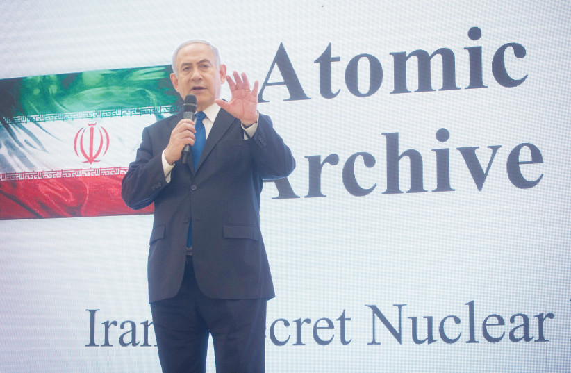 PRIME MINISTER Benjamin Netanyahu exposes files that prove Iran’s nuclear program in a press conference in Tel Aviv, in 2018. (photo credit: MIRIAM ALSTER/FLASH90)