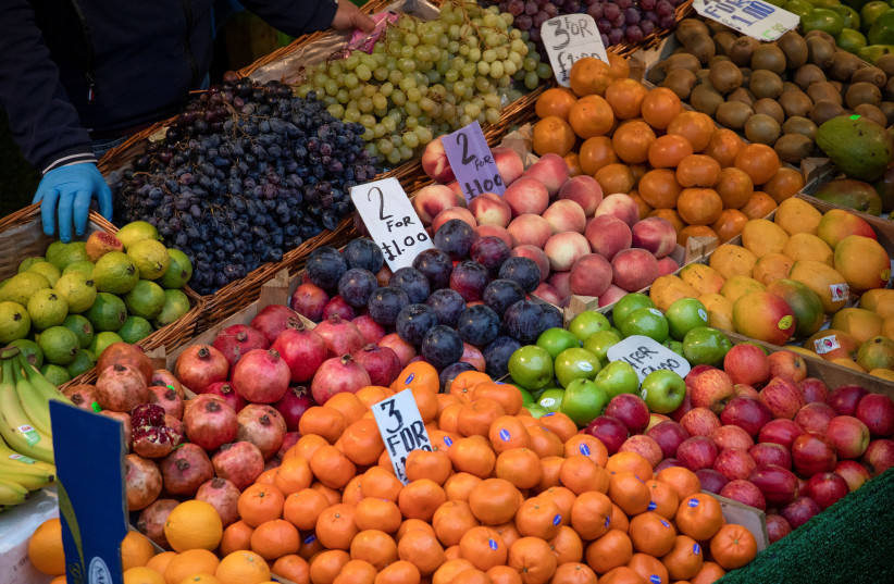 Fruit and vegetables sit on display at Brixton Market, London, September 27, 2020. (photo credit: SIMON DAWSON/ REUTERS)