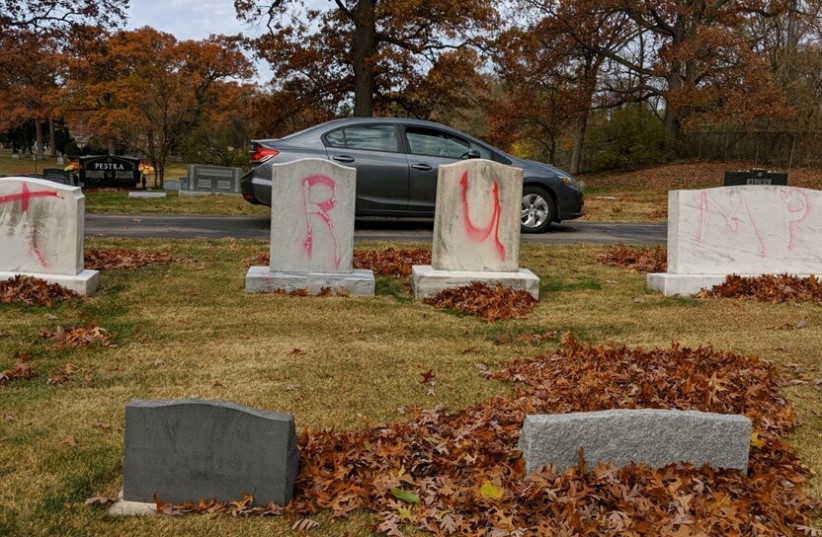 Graves are tagged with graffiti reading "TRUMP" at a Jewish cemetery in Grand Rapids. The graffiti was discovered on November 2. (photo credit: ADL)