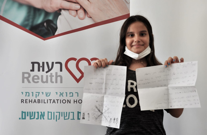 Yael Haza, with her letter to Dr. Orit Stein Reisner, November 4, 2020.  (photo credit: COURTESY REUTH)