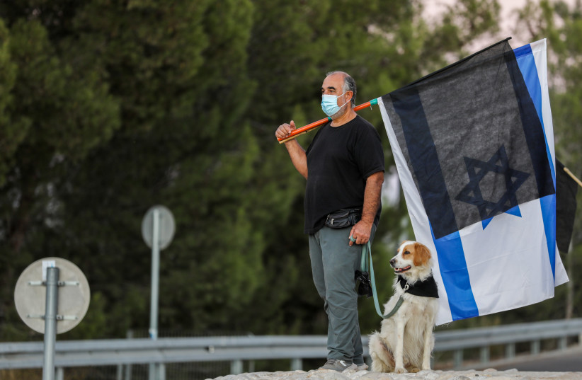 Israelis protest against Israeli prime minister Benjamin Netanyahu, outside Tzur Hadassah, October 17, 2020. (photo credit: NATI SHOHAT/FLASH90)
