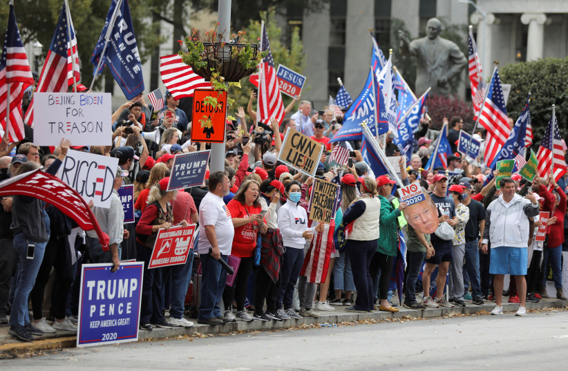 Supporters of US President Donald Trump participate on a 'Stop the Steal' protest at the Georgia State Capitol. US November 7, 2020. (photo credit: REUTERS/DUSTIN CHAMBERS)