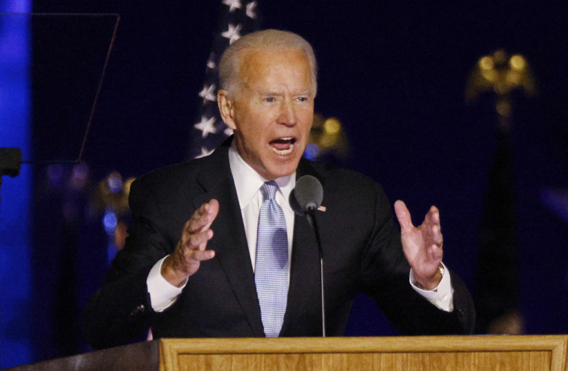 Democratic 2020 US presidential nominee Joe Biden speaks at his election rally, after news media announced that Biden has won the 2020 US presidential election, in Wilmington, Delaware, US, November 7, 2020. (photo credit: JIM BOURG / REUTERS)