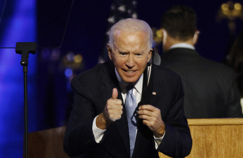 Democratic 2020 U.S. presidential nominee Joe Biden celebrates onstage at his election rally, after the news media announced that Biden has won the 2020 U.S. presidential election over President Donald Trump, in Wilmington, Delaware, U.S., November 7, 2020. (photo credit: JIM BOURG / REUTERS)
