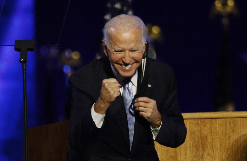 Democratic 2020 U.S. presidential nominee Joe Biden celebrates onstage at his election rally, after the news media announced that Biden has won the 2020 U.S. presidential election over President Donald Trump, in Wilmington, Delaware, U.S., November 7, 2020. (photo credit: JIM BOURG / REUTERS)