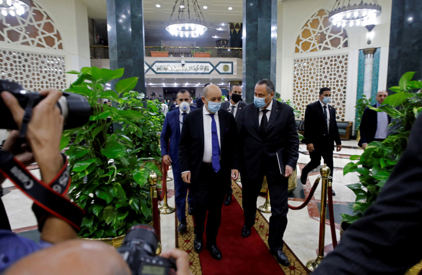 French Foreign Minister Jean-Yves Le Drian leaves after a news conference with Sheikh Ahmed al-Tayeb, the Grand Imam of Egypt's Al-Azhar (not pictured), in Cairo, Egypt November 8, 2020. (photo credit: REUTERS/MOHAMED ABD EL GHANY)