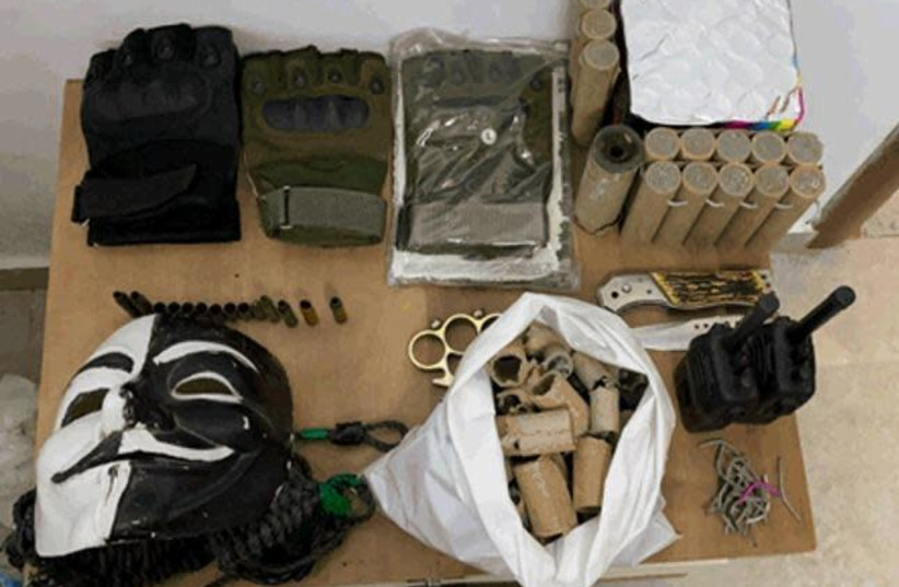 Weapons, ammunition, uniforms and money in order to carry out attacks in the West Bank confiscated by the Shin Bet (credit: SHIN BET)
