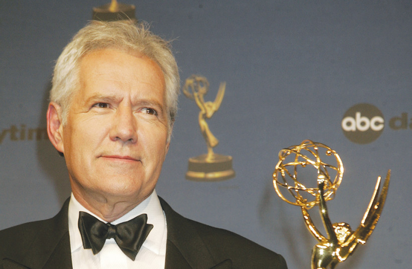 Alex Trebek, host of the game show ‘Jeopardy!,’ poses with his Emmy Award at the 33rd annual Daytime Emmy Awards in Hollywood in 2006.  (photo credit: FRED PROUSER/REUTERS)