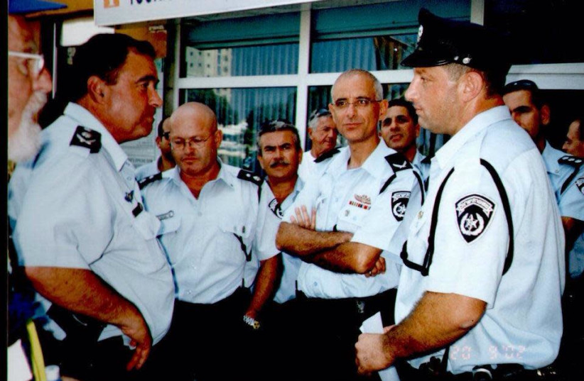 Marc Kahlberg (right), commander of the Tourist Police, with Insp.-Gen. Shlomo Aharonishki (left) and top police officers after the Park Hotel bombing in 2002 (photo credit: Courtesy)