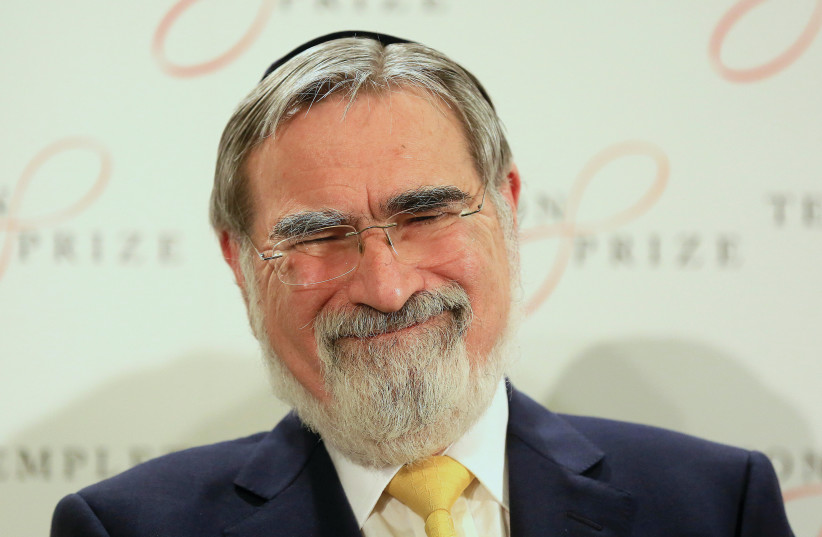 RABBI JONATHAN SACKS laughs during a news conference in London after being awarded the 2016 Templeton Prize, on March 2, 2016. (credit: PAUL HACKETT/REUTERS)