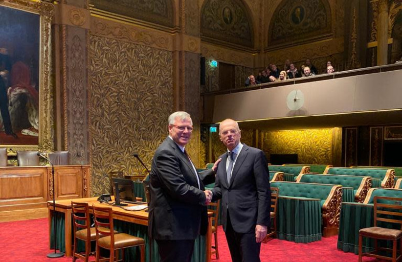 Dutch Ambassador to Israel Naor Gilon (left) is seen shaking hands with Duth Senate President Jan Anthonie Bruijn. (photo credit: ISRAELI EMBASSY IN THE HAGUE)