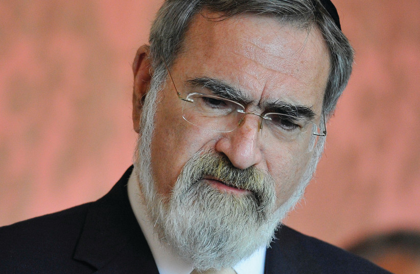 RABBI JONATHAN SACKS speaks at a meeting of religious leaders at St. Mary’s University chapel at Twickenham in West London, in 2010. (photo credit: TOBY MELVILLE/REUTERS)