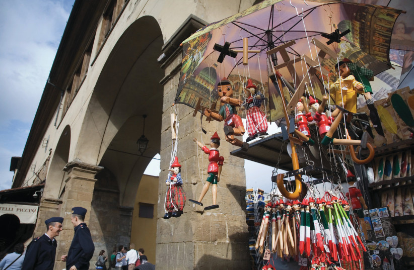 SOUVENIRS ON offer at the Ponte Vecchio (Old Bridge), Florence, Italy (photo credit: Wikimedia Commons)