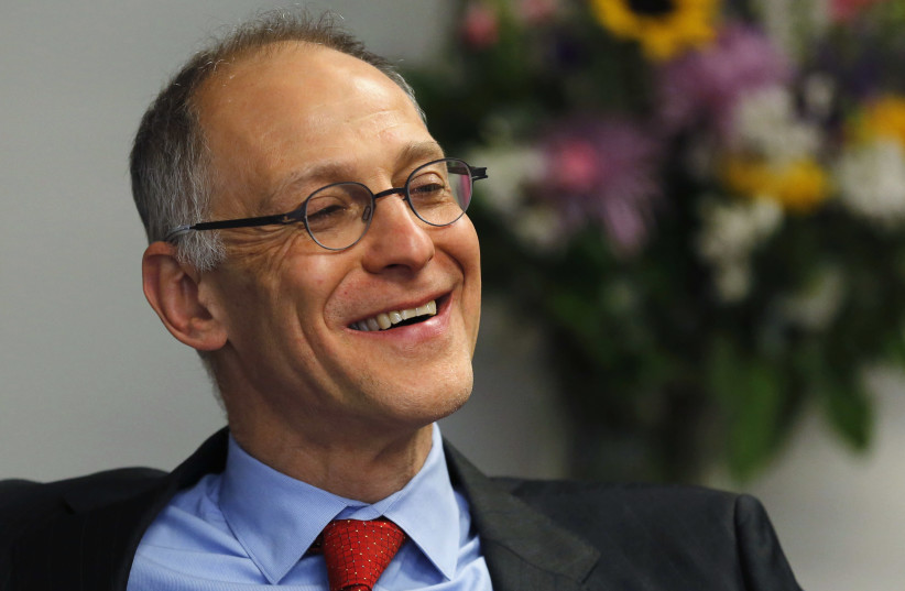 Dr. Ezekiel Emanuel, professor of Health Care Management at the Wharton School of the University of Pennsylvania, is interviewed at the Reuters Health Summit 2014 in Washington April 1, 2014. (photo credit: JIM BOURG / REUTERS)