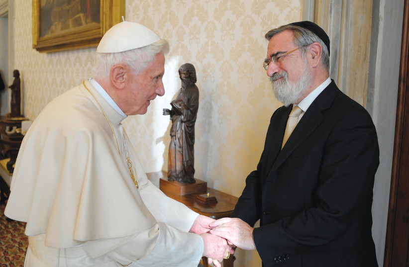POPE BENEDICT XVI greets Rabbi Lord Jonathan Sacks during a private audience at the Vatican in 2011. (photo credit: OSSERVATORE ROMANO / REUTERS)