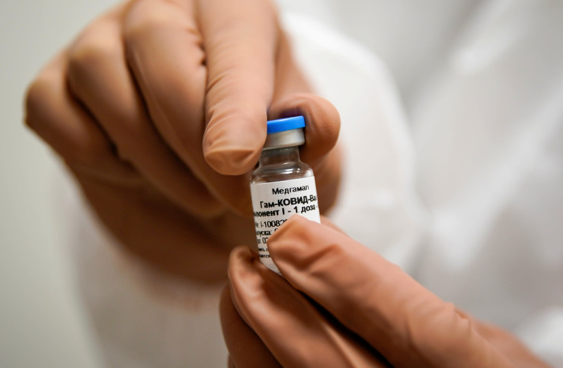 A nurse prepares Russia's "Sputnik-V" vaccine against the coronavirus disease (COVID-19) for inoculation at a clinic in Tver, Russia October 12, 2020. (photo credit: REUTERS/TATYANA MAKEYEVA/FILE PHOTO)