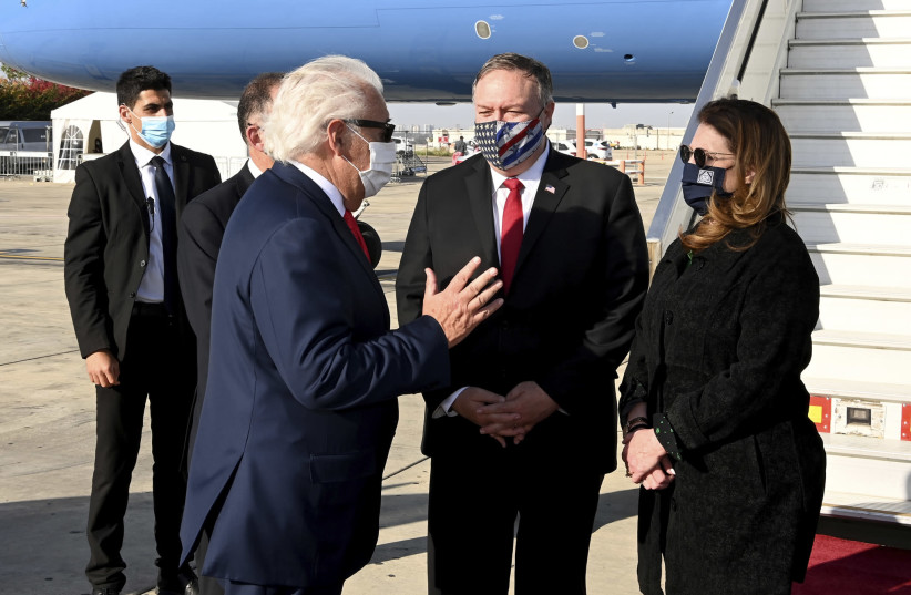 US Secretary of State Mike Pompeo is seen greeted by US Ambassador to Israel David Friedman at Ben-Gurion Airport. (photo credit: MATTY STERN / US EMBASSY JERUSALEM)