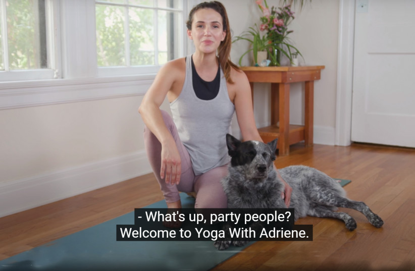 SCREENSHOT FROM Full-Body Flow by Yoga with Adriene (pictured with dog Benji, a fan favorite). (photo credit: YOUTUBE)