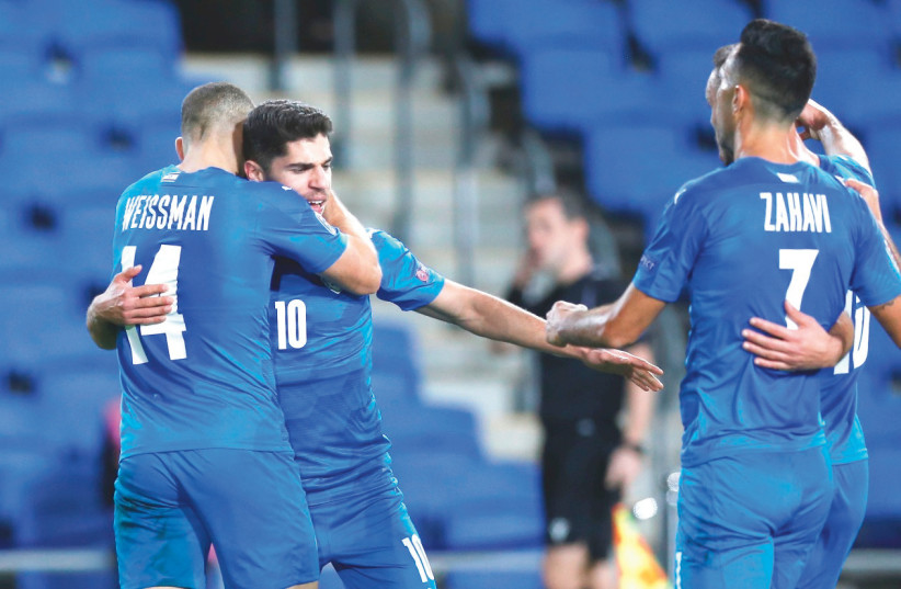 ISRAEL FORWARD Manor Solomon (10) celebrates with his teammates after scoring for the blue-and-white in its 1-0 victory over Scotland in the Nations League action on Wednesday night in Netanya. (photo credit: AMIR COHEN/REUTERS)